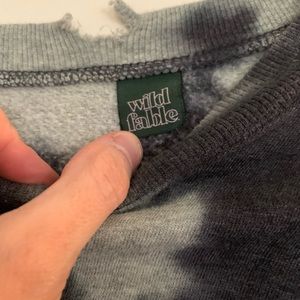 Tie dyed sweatshirt printed with the words get outside